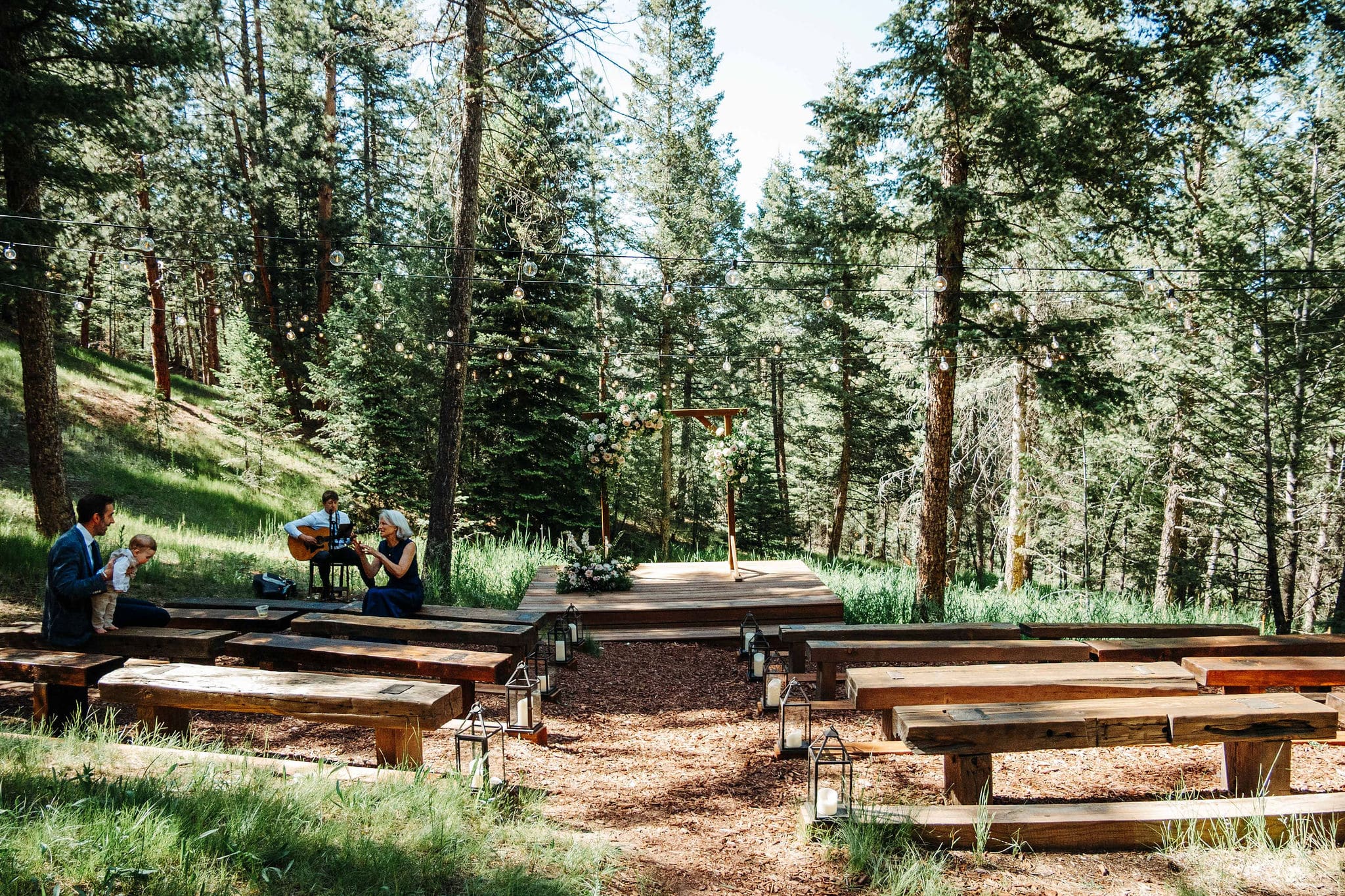 Emily & Adrian's wooded wedding ceremony at Juniper Lodge & Treehouses in Evergreen, Colorado.