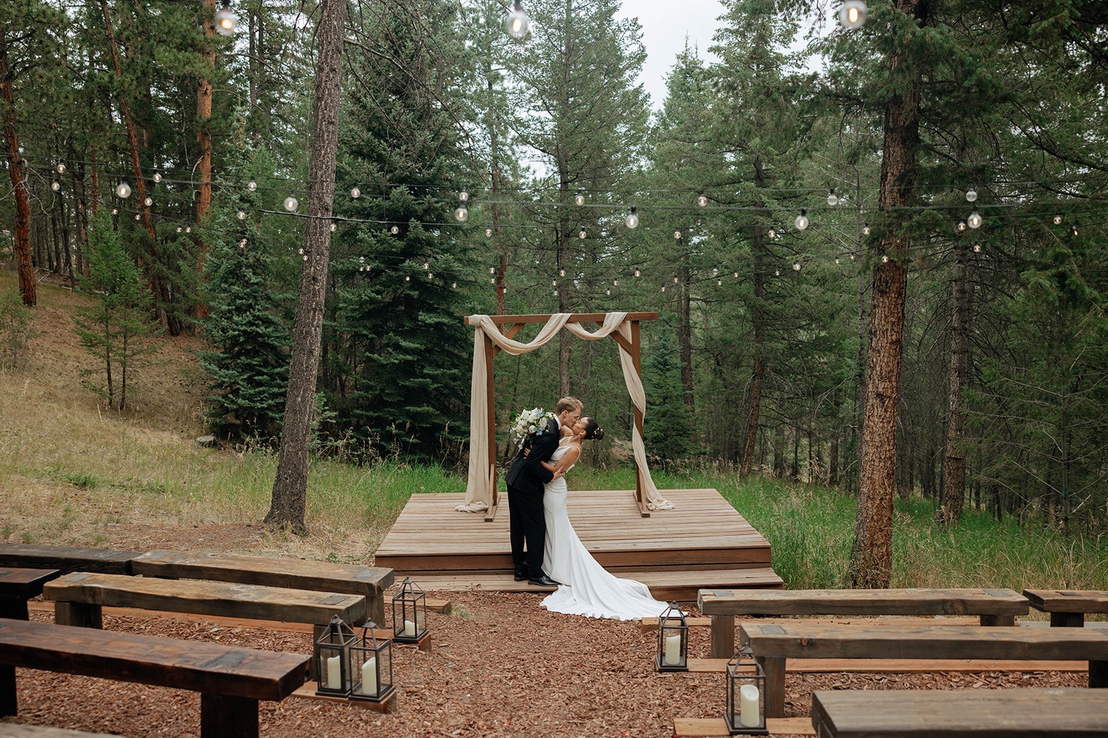 Meadow ceremony surrounded by Colorado pines at Juniper Lodge & Treehouses.