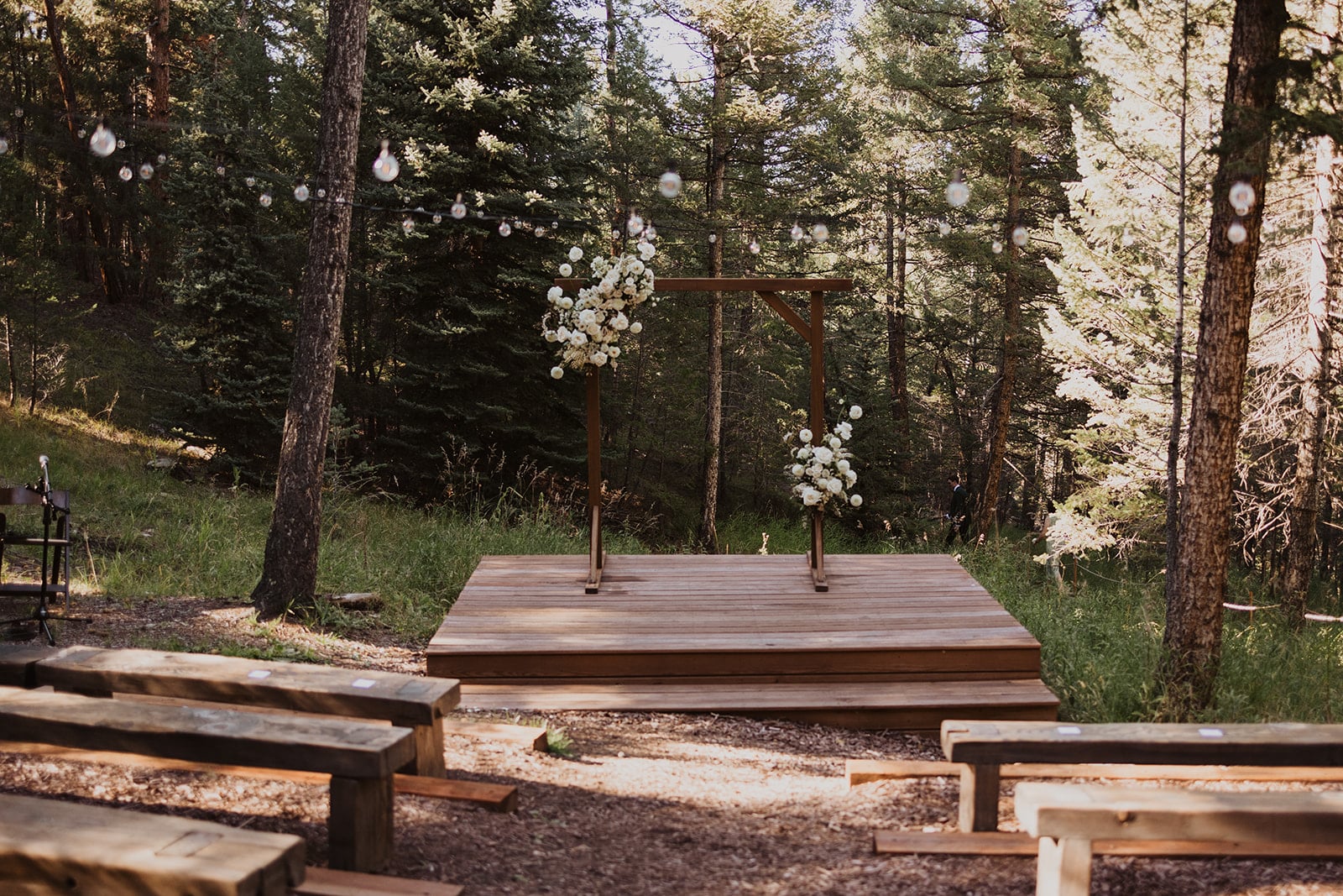 Golden-hour meadow ceremony at Evergreen wedding at Juniper Lodge & Treehouses.