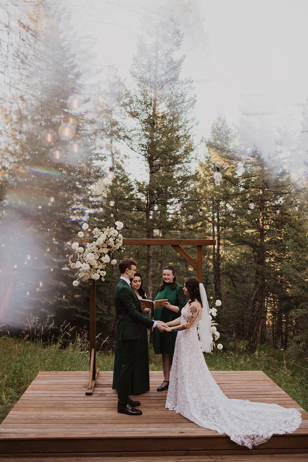 Golden-hour meadow ceremony at Evergreen wedding at Juniper Lodge & Treehouses.