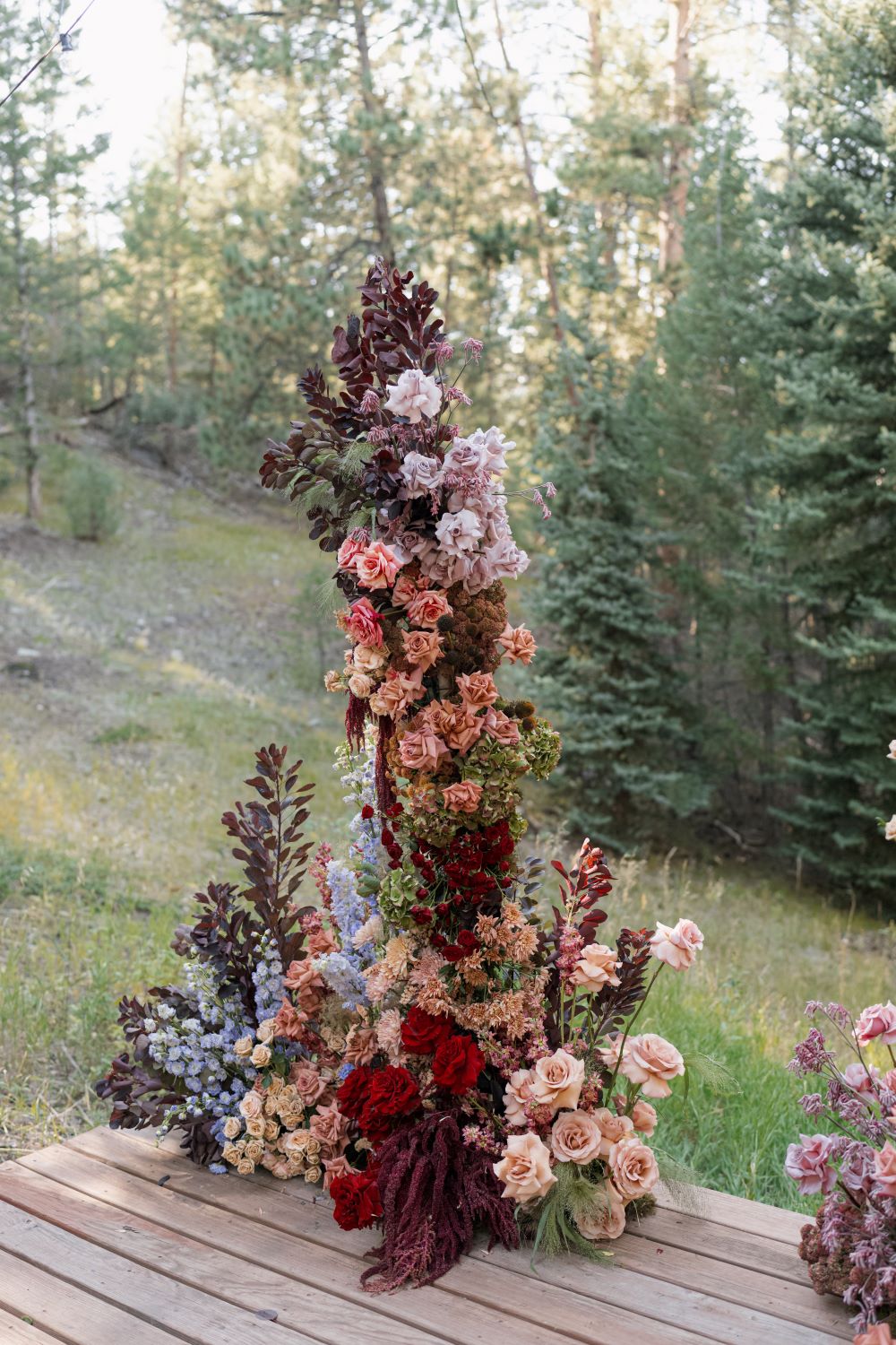 RLY RLY designs romantic florals for Cathy Lee & Cody's wedding at Juniper Lodge & Treehouses in Evergreen, CO.