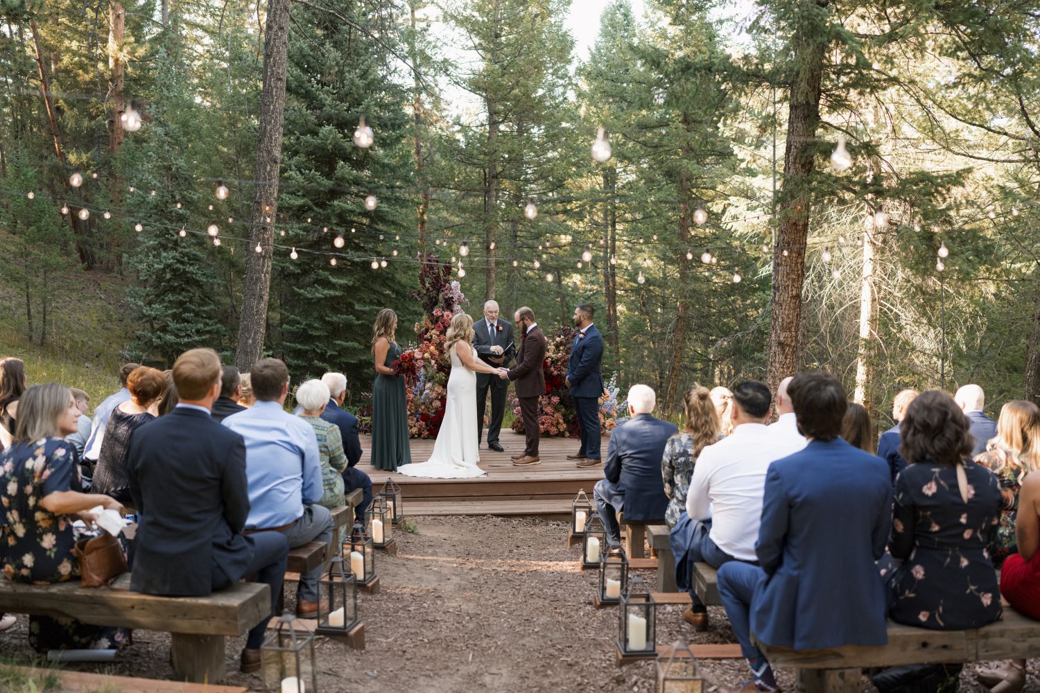 Cathy Lee & Cody say "I do" at their wedding at Juniper Lodge & Treehouses in Evergreen, Colorado.