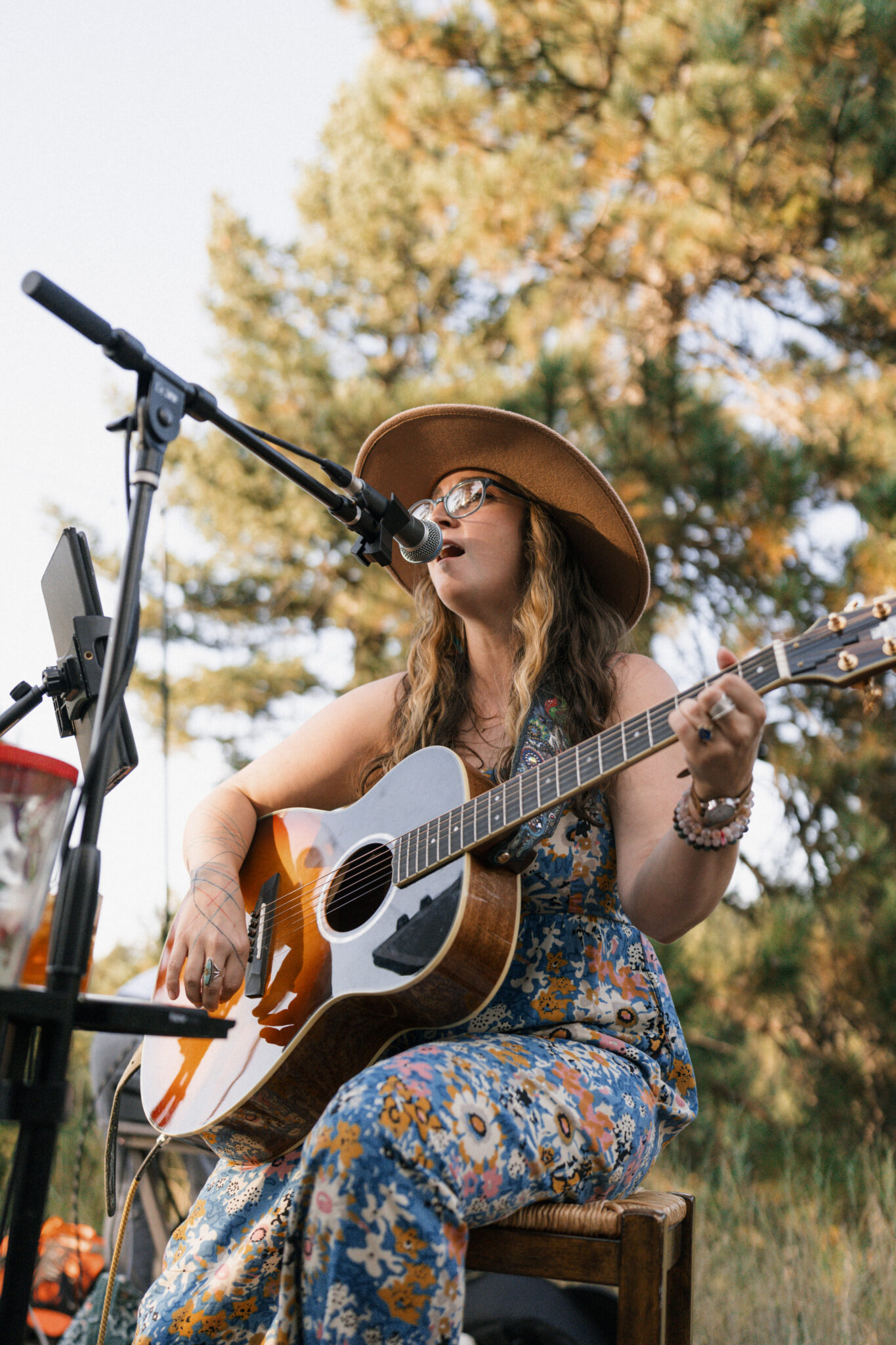 Alexa Kilgore performs for Cathy Lee & Cody's wedding at Juniper Lodge & Treehouses in Evergreen, Colorado.