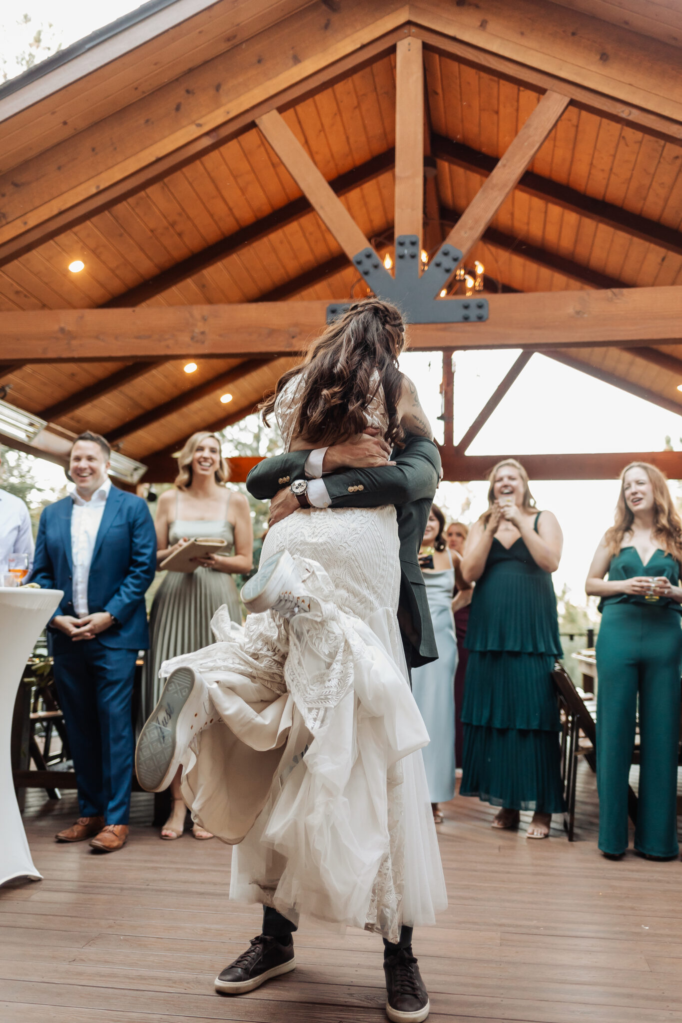 Keller and Dan sharing their first dance under string lights