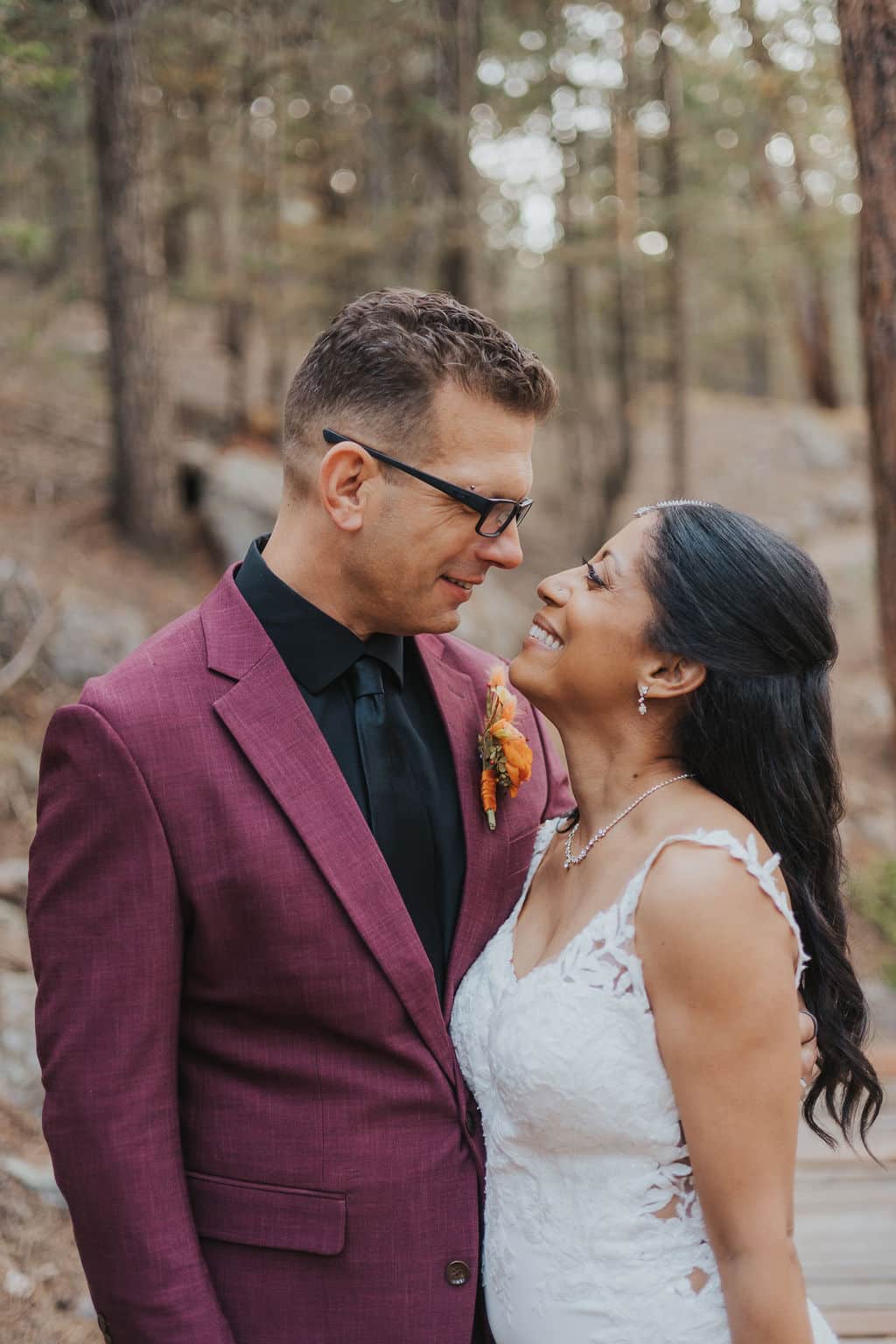 Couple portraits in fall foliage at Juniper Lodge & Treehouses.