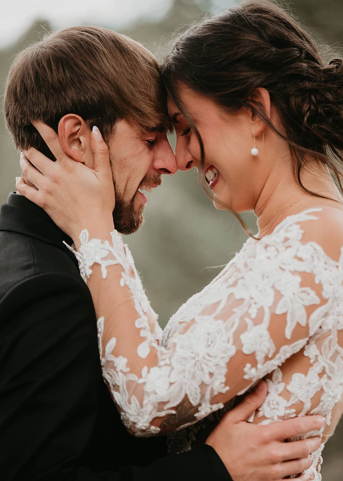 Couple’s first look on the deck surrounded by pine trees and mountain views.