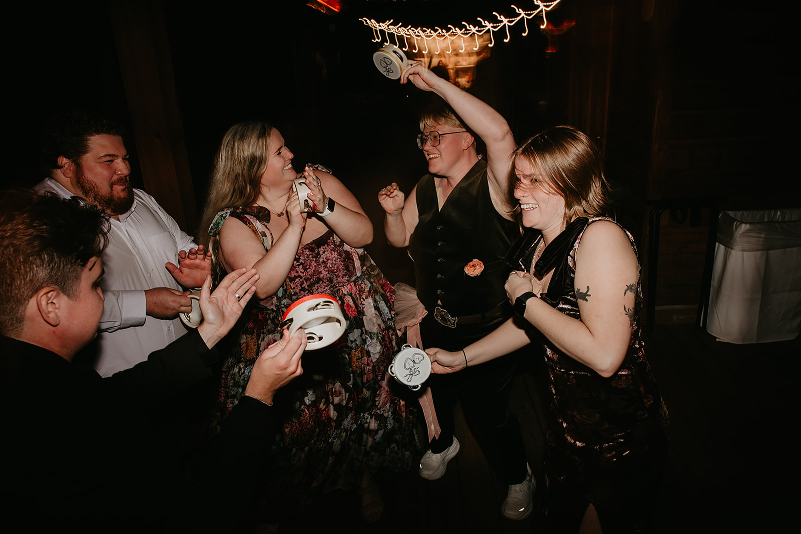 Guests celebrate at Juniper Lodge during an Evergreen Colorado fall wedding reception.