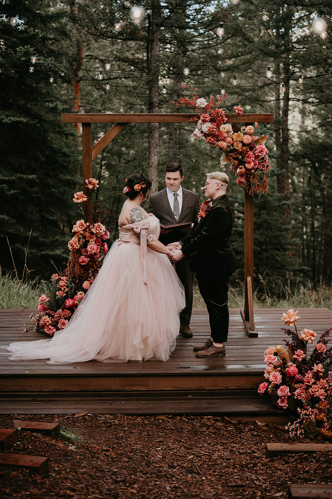 Kellie & Sarah say I do at their ceremony in Evergreen Colorado at Juniper Lodge & Treehouses.