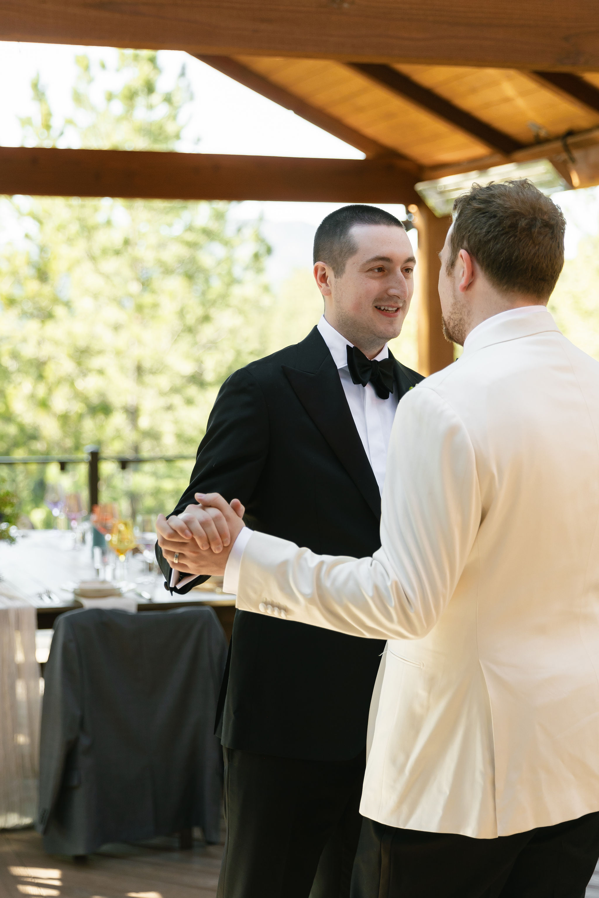 Ty and Tyler share a first dance on the deck after their Evergreen Colorado micro wedding ceremony.