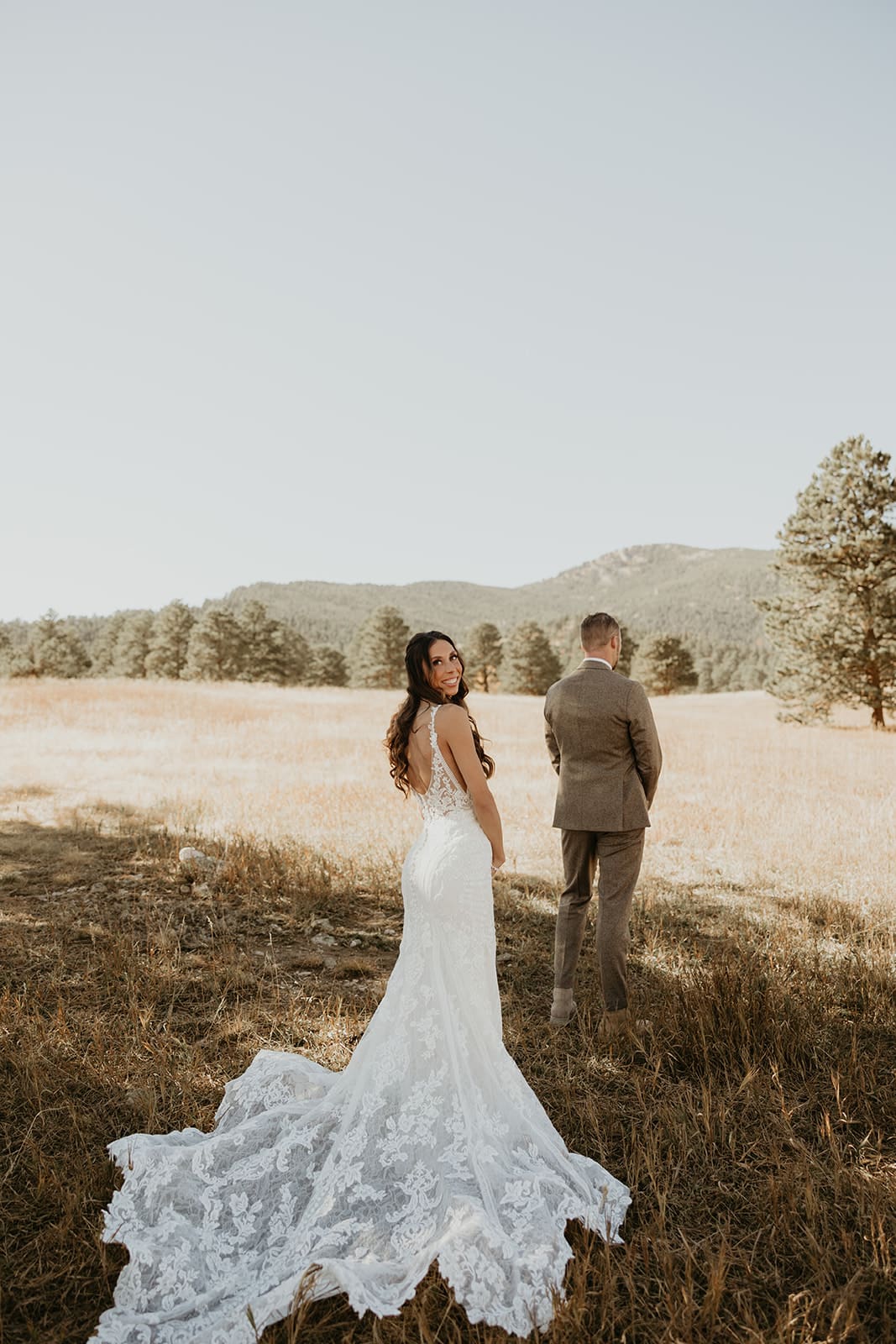 Bride and groom first look at Elk Meadow during Evergreen fall wedding at Juniper Lodge & Treehouses.