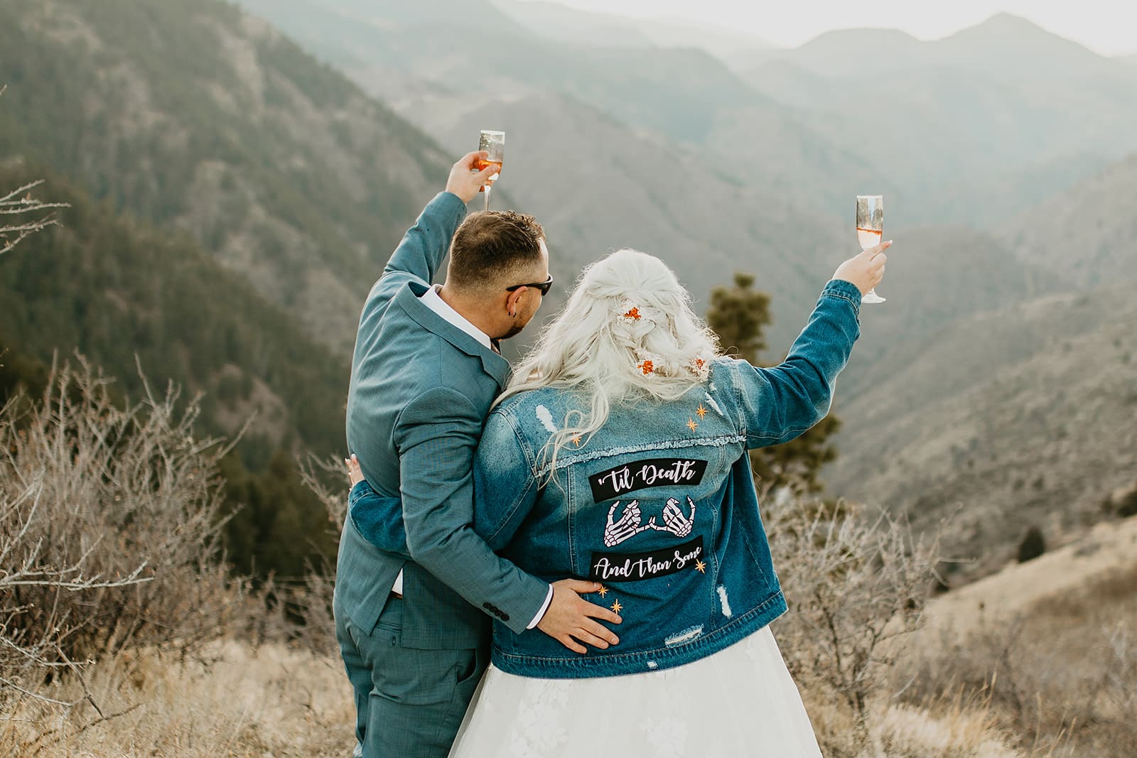 Bride wearing custom jean jacket that reads ‘Til Death and Then Some