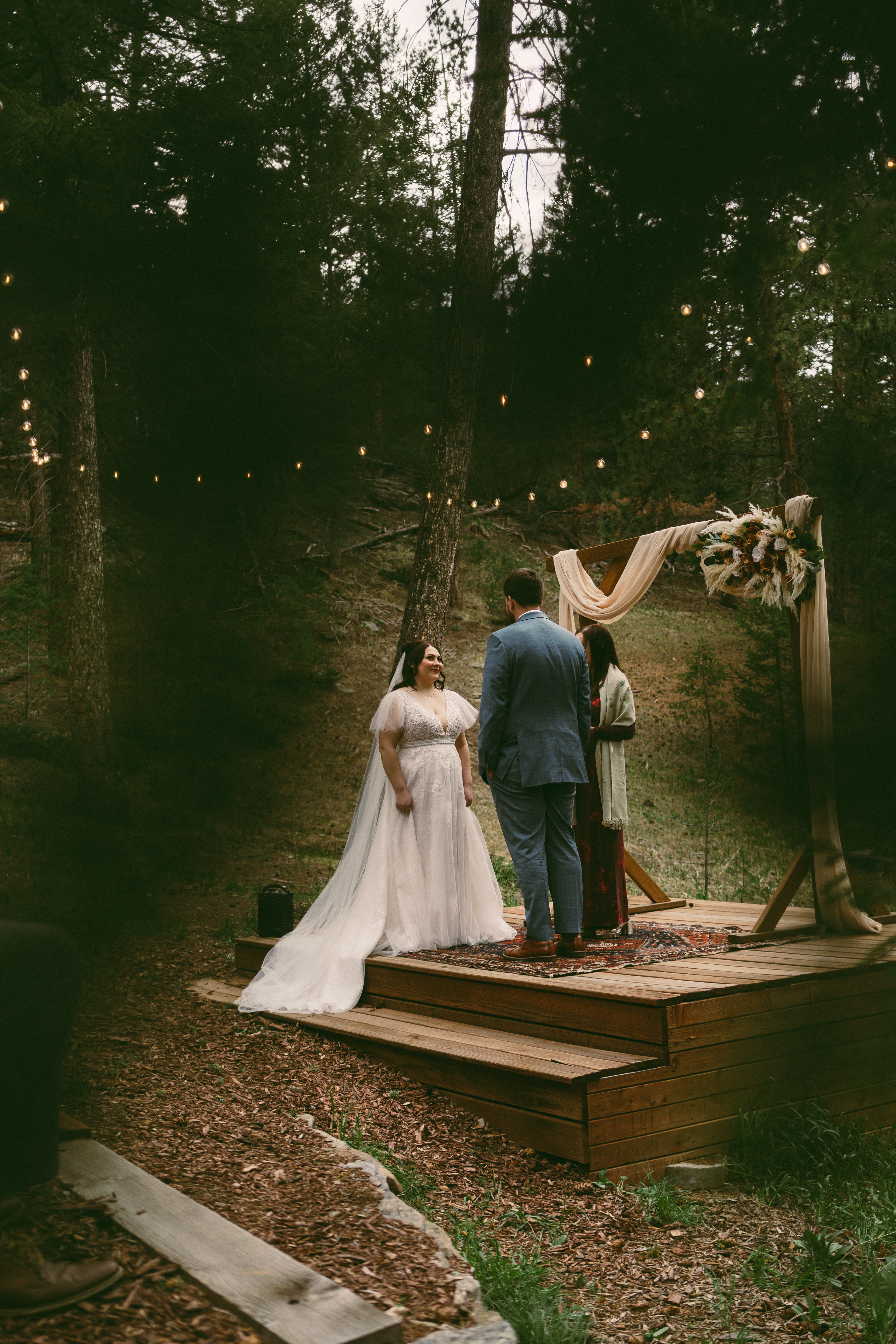 couple exchanging vows during intimate meadow wedding at Juniper