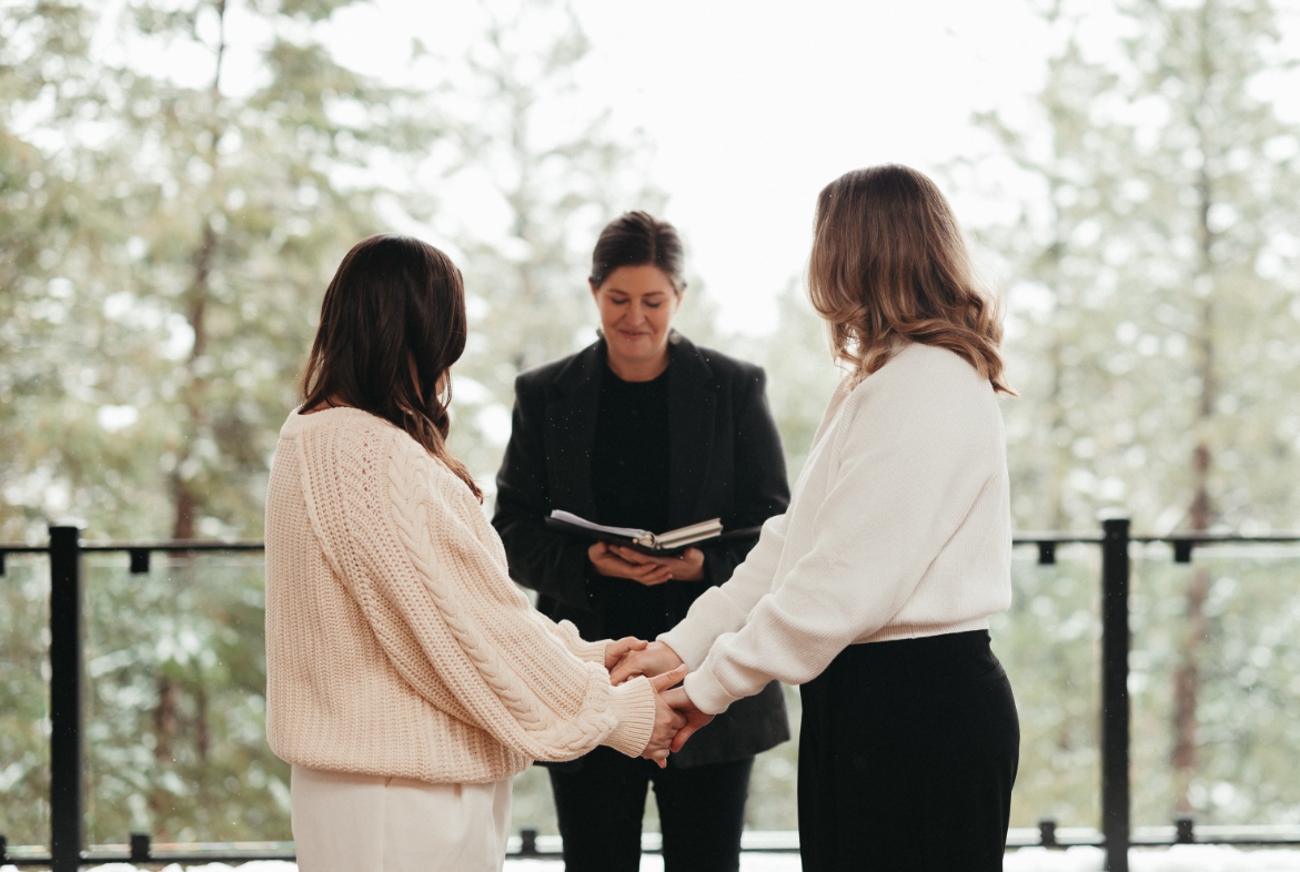 Lesbian couple say wedding vows at Juniper Lodge & Treehouses