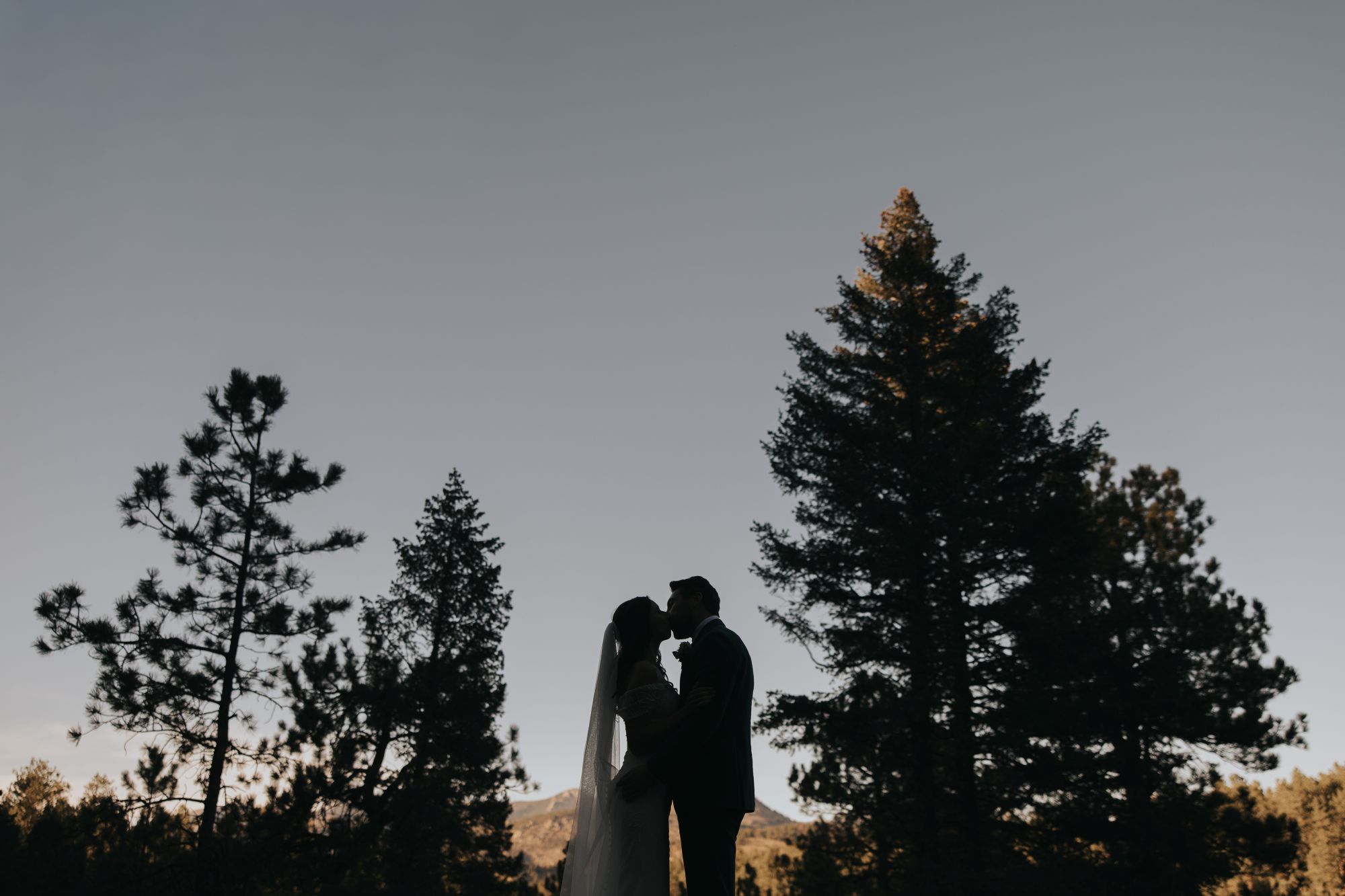 Bride and groom golden hour photos at Juniper Lodge & Treehouses in Evergreen Colorado